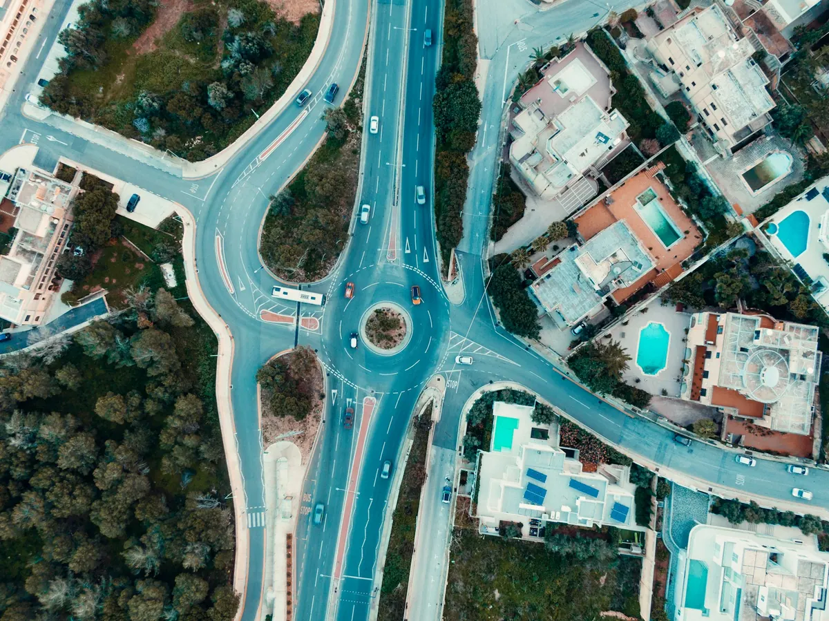 Aerial view of an urban road network and roundabout